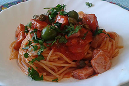 Spaghetti in red tuna sauce with capers